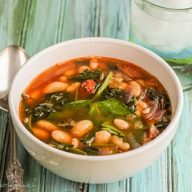 Garlic, White Bean & Chorizo Stew With Spinach and Sherry Vinegar is a warming bowl of soup that translates to a comfort food dinner!