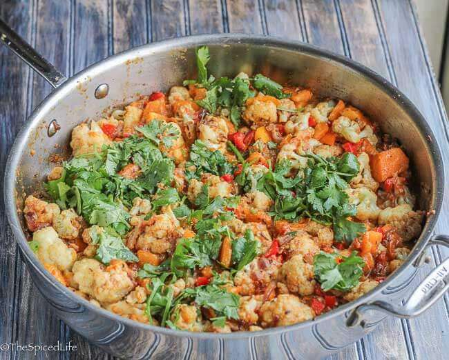 Gobi Taka Tak, or Indian Sautéed Cauliflower with Peppers, Tomatoes and Yogurt is an easy, fast and delicious vegetable side dish for any curry, pilaf or main meat!