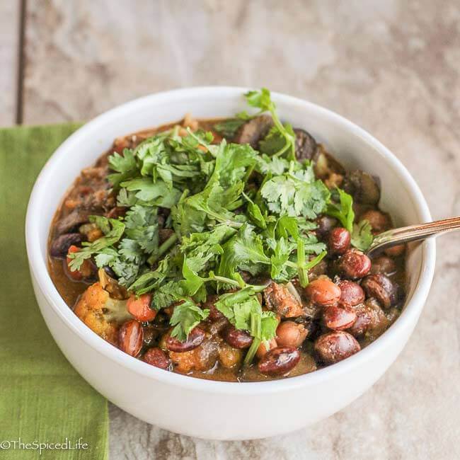 Indian Bean and Chickpea Stew with Mushrooms and Cauliflower: this is gateway Indian food! I haven't met anyone who does not love this super healthy vegetarian dinner! I sold my mom on curry with this!