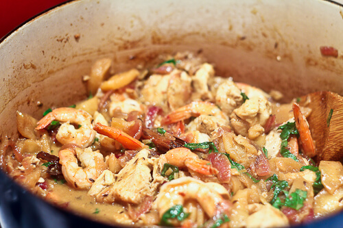 Indian Shrimp and Chicken Curry with Apples and Basil cooking in le creuset French oven