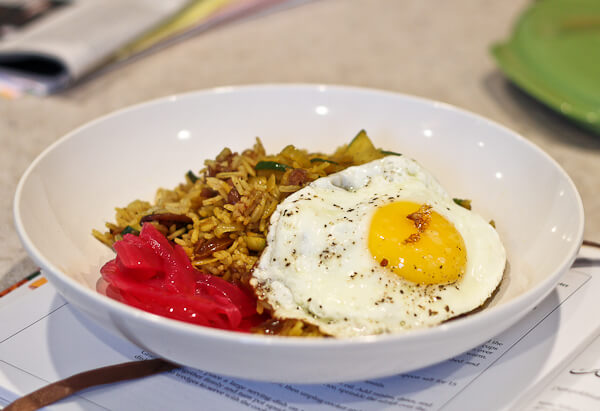 Persian Rice and Beans with pickled red onions and fried eggs, sunny side up