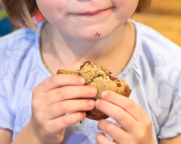 child eating browned butter chocolate chunk cookie