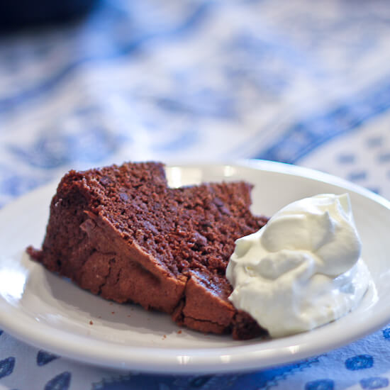 A slice of Chocolate Early Grey Bundt Cake with whipped cream