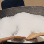seasoning cast iron wok with salt
