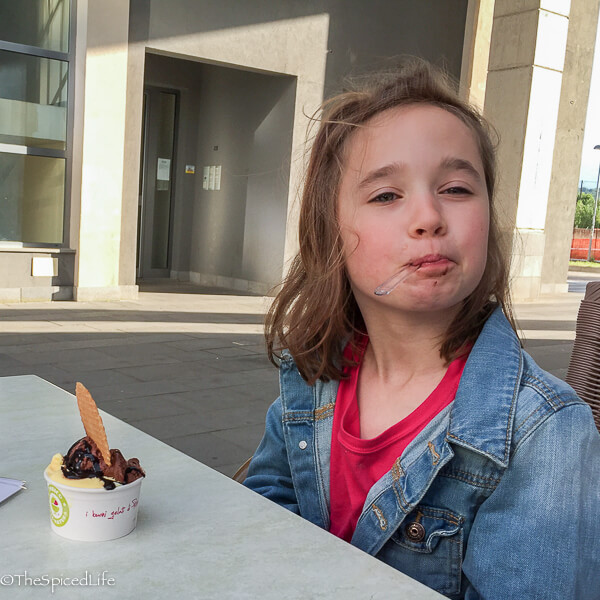 Child eating gelato in Italy