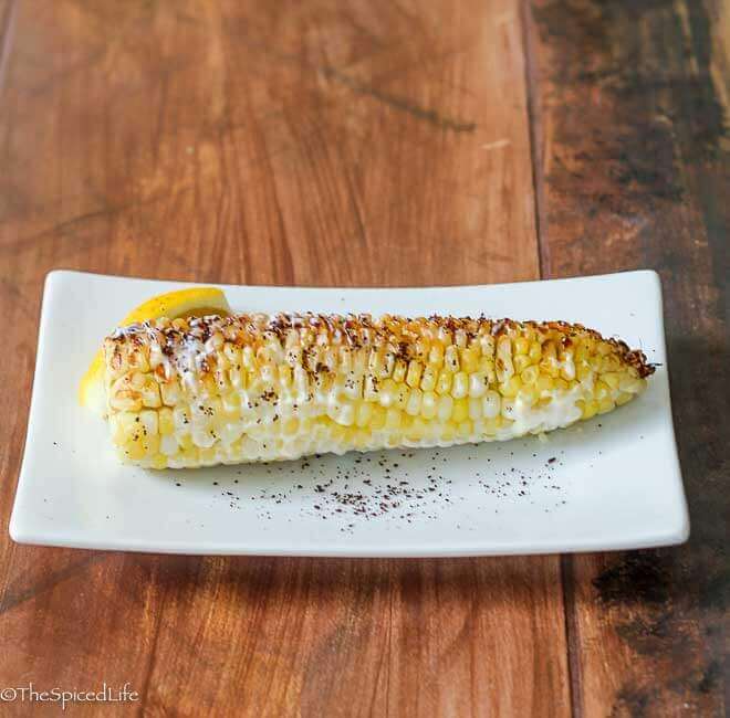 Middle Eastern Twist on Street Corn: Grilled Corn slathered in Lemon Garlic Sauce and sprinkled in Sumac